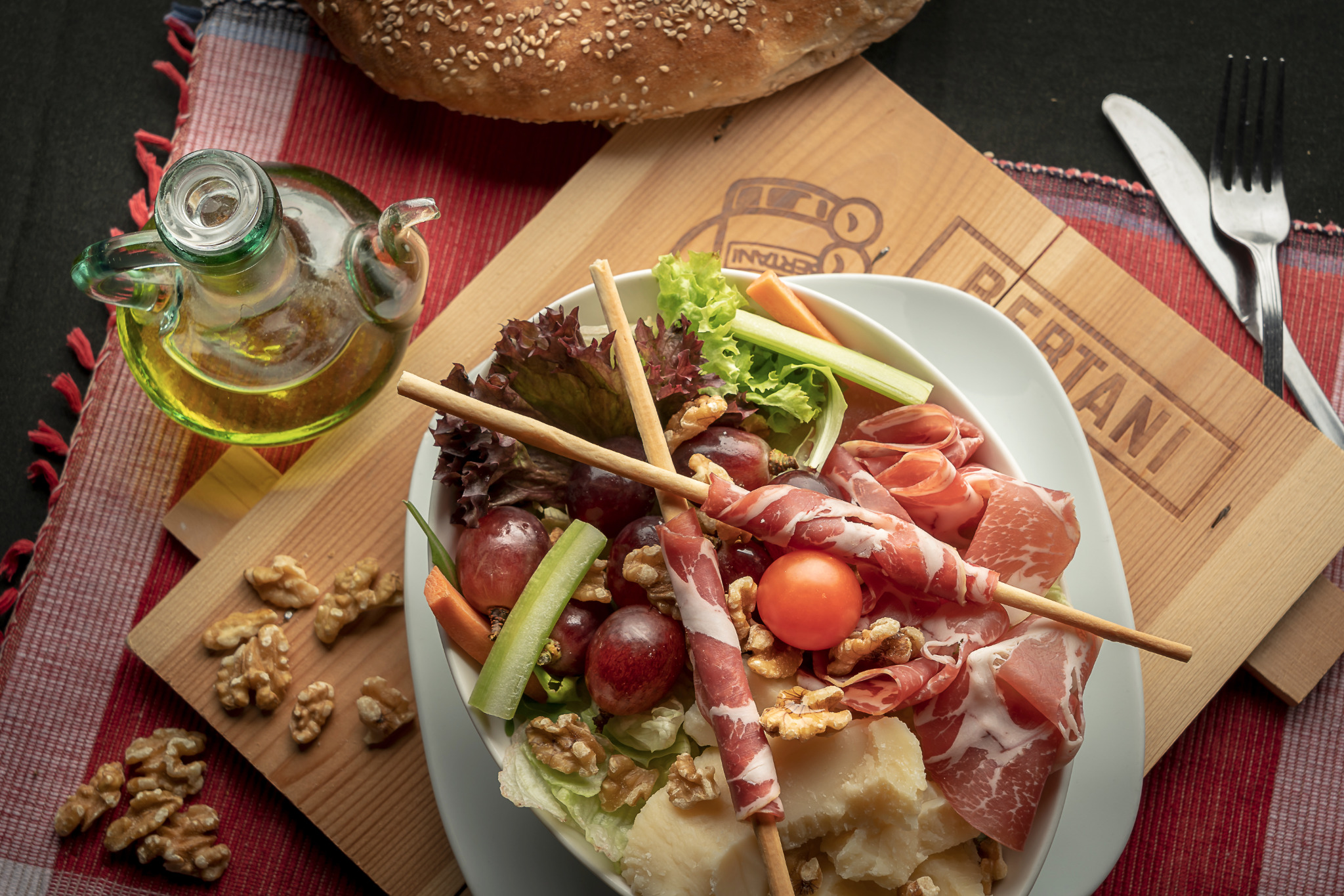 Charcuterie bowl with grapes and cured meats